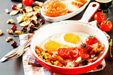 Breakfast including coffee, fried egg , becon. nut , muesli and bread . Selective focus