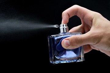Cologne or perfume bottle being sprayed- isolated image © BillionPhotos.com