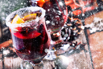 Christmas and New Year festive drink, hot mulled wine with cinnamon, cardamom, orange and anise...