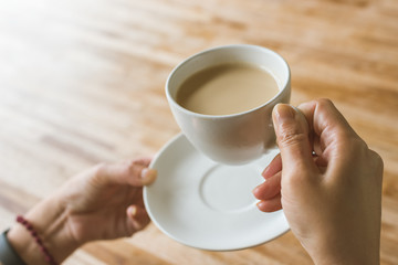 woman hold a cup a coffee