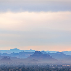 Naklejka na ściany i meble Mountain range of Arizona beneath a misty sky