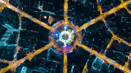 Aerial view highway road 6 way intersection roundabout or circle at dusk for transportation, distribution or traffic background. - 228446931
