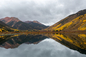 Colorado mountains reflecting on lake 