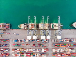 Container cargo ship an important transportation and Logistics Cargo containers on to the International port / Cargo ship - Cargo to harbor. Aerial view from drone
