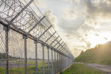 wire mesh steel with green grass background in Phuket Thailand