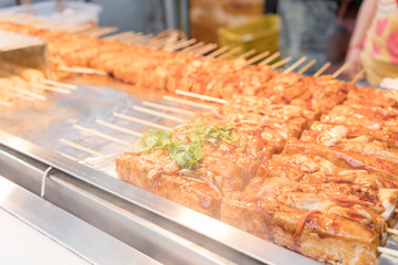 Popular stinky tofu with spicy sauce selling on Shilin street market , New Taipei City , Taiwan