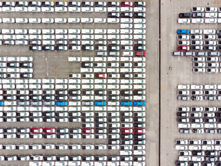 Aerial top view photo from flying drone, New Cars produced Several times a year at industrial estate for import export around in the world