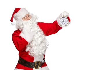 Santa Claus points finger at the clock. Christmas concept.