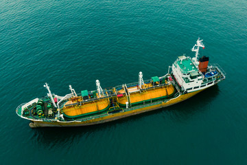Aerial Top View of sea freight, Crude oil tanker lpg ngv at industrial estate Thailand / Crude Oil tanker to Port of Singapore - import export around in the world