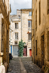 Narrow street in historic city centre of Bordeaux