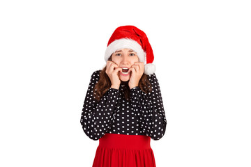 Nervous scared woman with his sorrowful expression, clenched teeth, finds out about tragic event. emotional girl in santa claus christmas hat isolated on white background. holiday concept