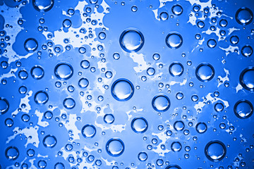 fresh drops background blue glass / wet rainy background, water drops transparent glass blue