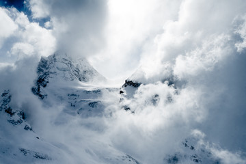 Fototapeta na wymiar A storm in the high snowy mountains