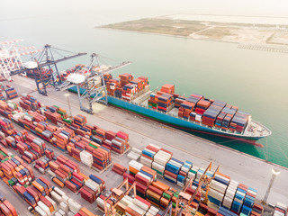 Aerial view of Large container ship at sea freight, Business International trade and Container logistics export-import harbor to the International port / Shipping Containers concept.