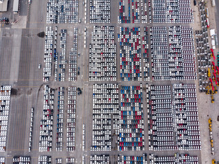Aerial top view photo from flying drone, New Cars produced Several times a year at industrial...