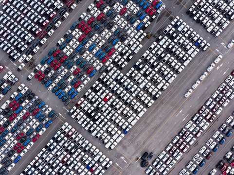 Aerial top view photo from flying drone, New Cars produced Several times a year at industrial estate for import export around in the world