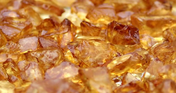 Close up brown glass split stones on a rotating plate