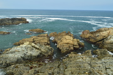 Views Of The Bay With The Waves Breaking On Its Rocks At Tapia De Casariego. Nature, Travel, Recreation. August 2, 2018.Tapia De Casareigo, Asturias, Spain.