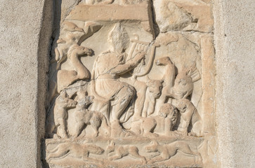 Roman relief of Orpheus with animals in the church wall at Smartno on the mountain Pohorje, Slovenia