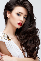 Brunette asian girl with long curly hair