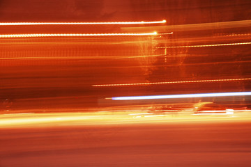 Lines of abstract orange lights, background in long exposure