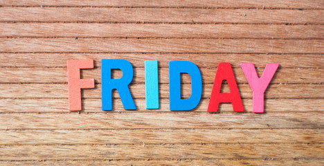 Colorful wooden alphabet with text friday