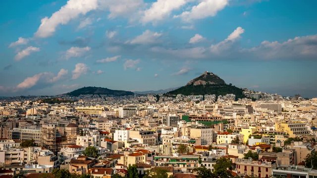Athens panorama. Lycabettus hill is in the background. Clouds move across the blue sky.