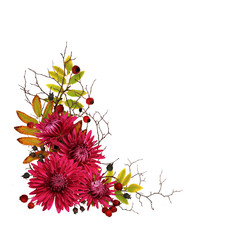 Purple chrysanthemum flowers and autumn dry twigs in a corner arrangement
