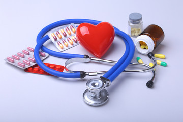 stethoscope and red heart, Colored Pills, Tablets, Capsules Blisters for Pharmacy and Medicine.
