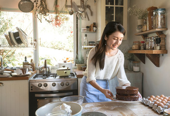Japanese woman making chocolate fudge cake