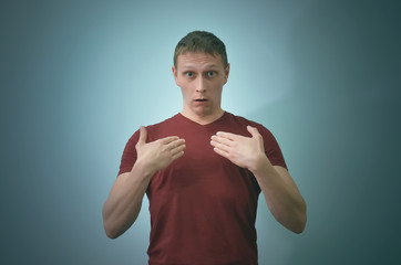 Accused man is justify himself isolated on blue background.