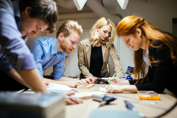Business people collaborating in office and working on project together