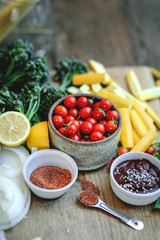 Fresh organic vegetables and ingredients prepared on a cutting board