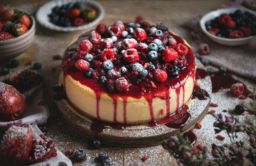 Cheesecake covered with mixed berries - obrazy, fototapety, plakaty
