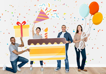 Happy diverse people holding birthday cake