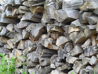 Preparation of firewood for the winter. firewood background, Pile Stacks of firewood