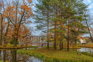 Marble bridge in autumn foliage in Catherine park (Pushkin), St. Petersburg, Russia
