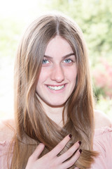 Portrait of pretty smiling woman posing at home