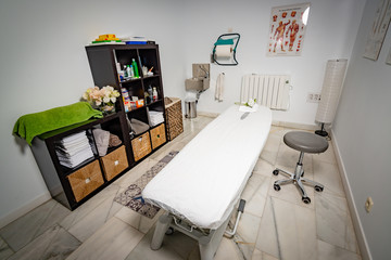 A physiotherapy cabinet at a Clinic, side standing view, ready to attend patients