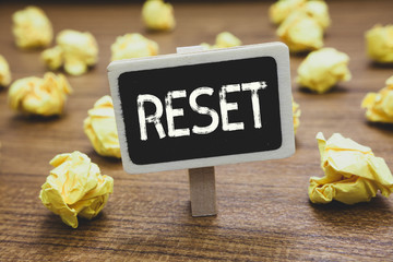 Writing note showing Reset. Business photo showcasing cause device return to its factory mode Set...