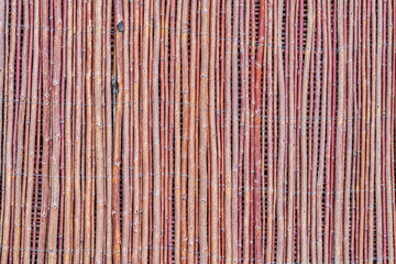 old fence, made from willow tree twigs and branches. © Вячеслав