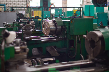 View of a large metal industrial machine in the shop for processing iron products. Industrial Tourism.
