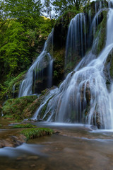 Obraz premium French landscape - Jura. Waterfall in the Jura mountains after heavy rain.