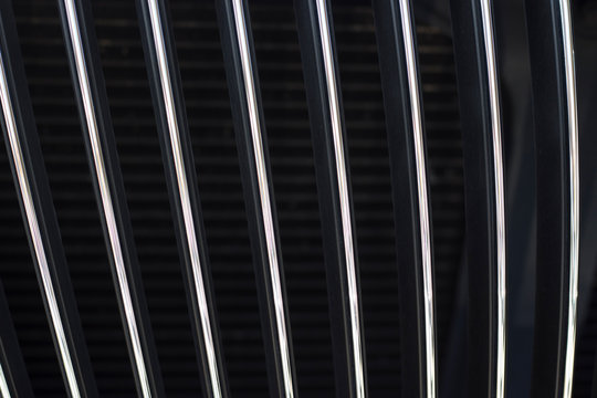 Black radiator grille. Grid of car close-up, texture, background