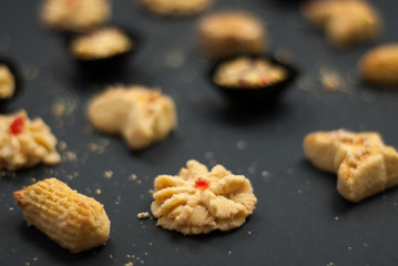 Cookies or biskut raya on black background. Special food for Eid festival or Hari raya