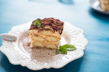 Italian tiramisu dessert on a porcelain plate