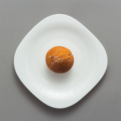 Freshly baked butter croissant grey background, top view