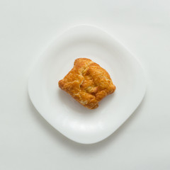 Freshly baked butter croissant white background, top view