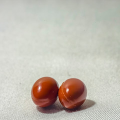 Two oblong pills against a white background