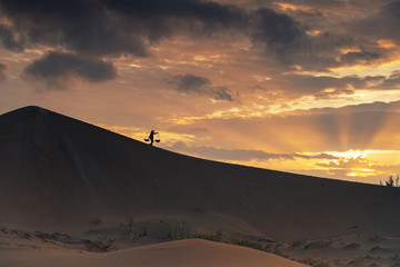 Vietnamese woman and her cgild walk on  the sand due in Phan Rang, Vietnam. ( Models intentionally...